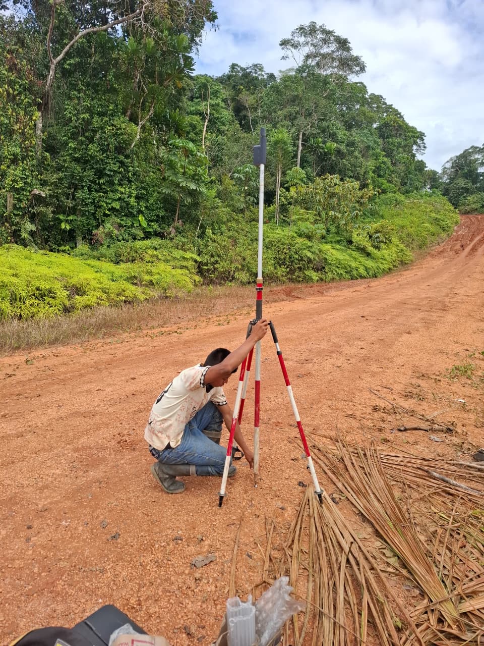Taking topographic ground points for a road project.